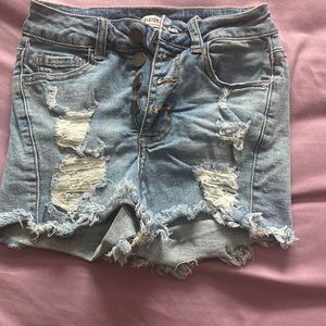 rips in the front and small rips on the sides and stretchy material